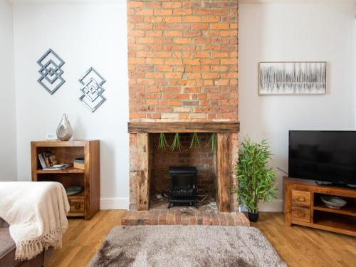 TV a/nebo společenská místnost v ubytování Ashtree Farmhouse
