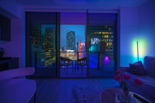 a living room with a view of a city skyline at Luxe Ventures Miami in Miami