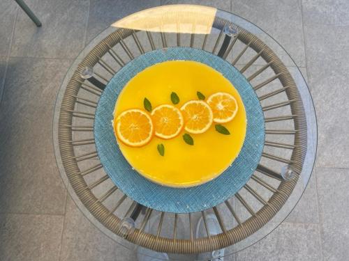 a bowl of orange slices on a plate on a table at B&B La mia Isola in Castelluzzo