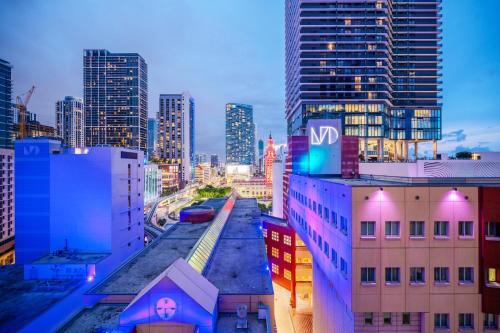 a city skyline at night with a train on the tracks at Luxe Ventures Miami in Miami