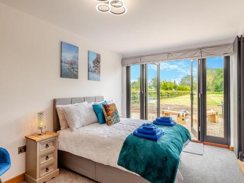 Ένα ή περισσότερα κρεβάτια σε δωμάτιο στο Gladwyns Farm Lodge