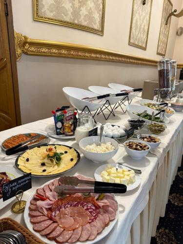 a table with many different types of food on it at Pava De Luxe in Berehove