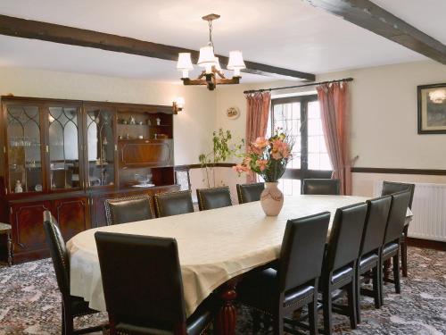 a dining room with a table and chairs at The Old School in Durham