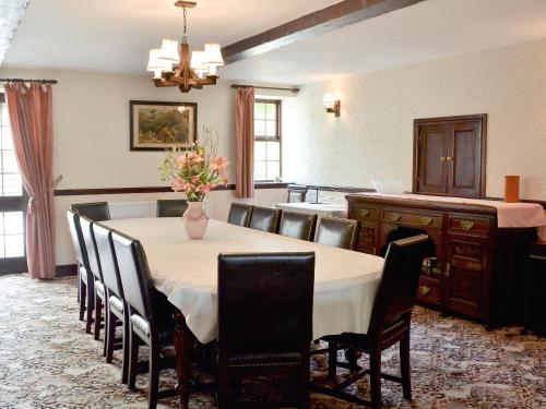 a dining room with a table and chairs at The Old School in Durham