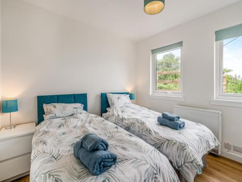 Ένα ή περισσότερα κρεβάτια σε δωμάτιο στο Sea Breeze Cottage