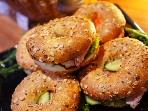 a pile of bagel sandwiches sitting on a plate at ibis Styles Wałbrzych in Wałbrzych