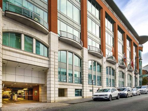 a large building with cars parked in front of it at ibis Styles Birmingham Centre in Birmingham