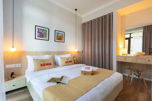 a bedroom with a king sized bed in a room at Apartment KeyGo #0066 comfort and coziness in the city in Yerevan