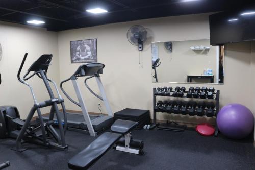 a gym with two exercise bikes and weights at The Lodge at Woodstone Country Club in Danielsville