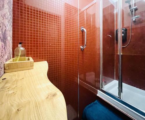 a bathroom with a shower and a toilet and a sink at Daiches Braes Brunstane Portobello in Edinburgh