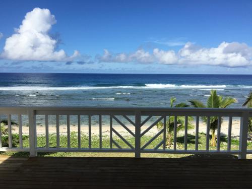 a view of the ocean from the balcony of a beach at Seaside Beachfront Villas Rarotonga in Rarotonga