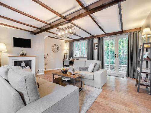 a living room with a couch and a table at Forge House in Thornton Dale