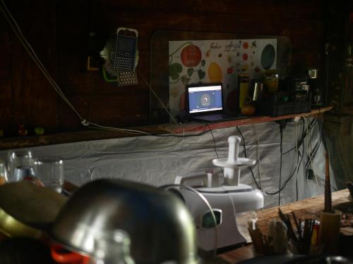 a room with a table with a laptop computer on it at Mettavasi in Kutaisi