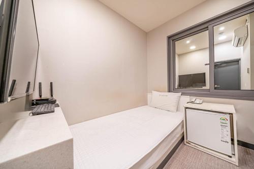 Kuchyň nebo kuchyňský kout v ubytování Top Motel Busan