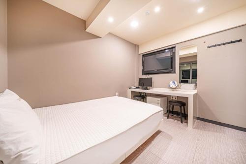 Postel nebo postele na pokoji v ubytování Top Motel Busan