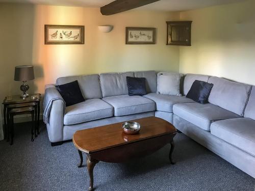 a living room with a couch and a coffee table at Brynfields in Shirley