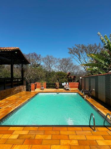 a large swimming pool in a yard at Casa Chácara Cambuquira in Cambuquira