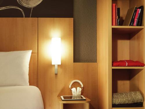 Postel nebo postele na pokoji v ubytování ibis Soissons