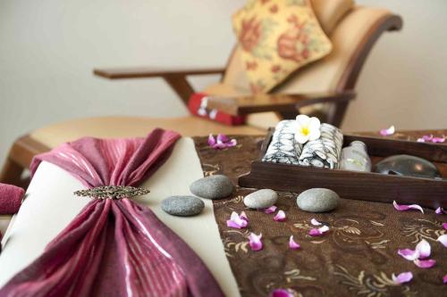 a table topped with a purple dress and some rocks at The Royal Surakarta Heritage - Handwritten Collection in Solo