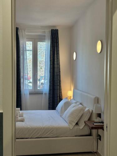 a bedroom with a large bed with a window at BluBay in Manarola