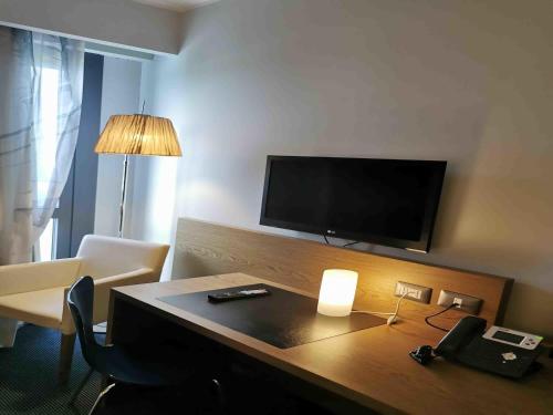 Télévision ou salle de divertissement dans l'établissement Ibis Styles Roma Eur