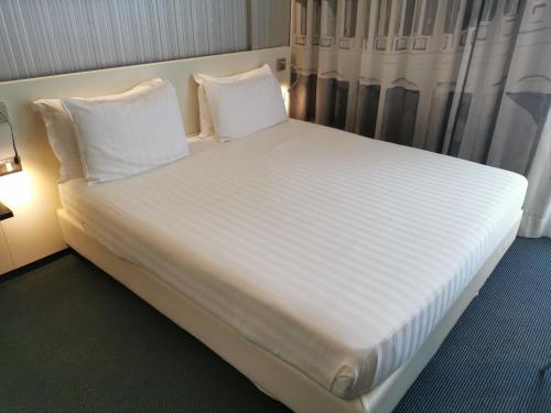 Un ou plusieurs lits dans un hébergement de l'établissement Ibis Styles Roma Eur
