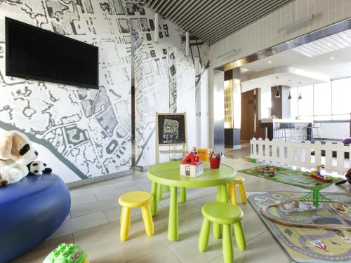 Télévision ou salle de divertissement dans l'établissement Ibis Styles Roma Eur