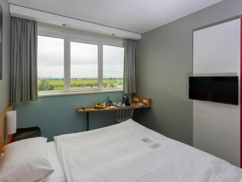 Cama o camas de una habitación en Ibis Vienna Airport