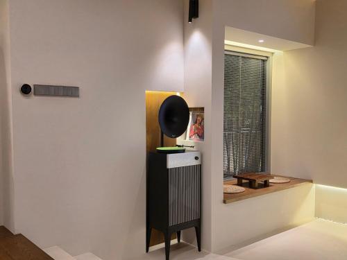 a room with a window and a black and white object at Hyu Stay in Gyeongju