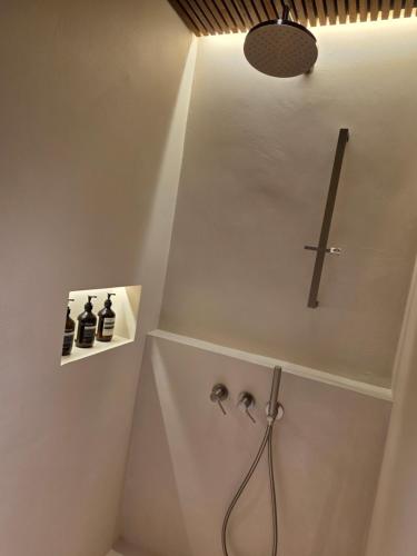 a bathroom with a religious cross on the wall at Hyu Stay in Gyeongju