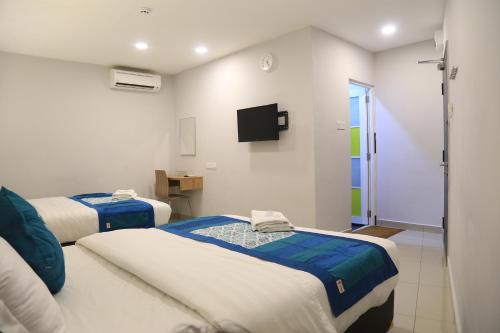 Cama o camas de una habitación en Lavana Hotel Batu Caves