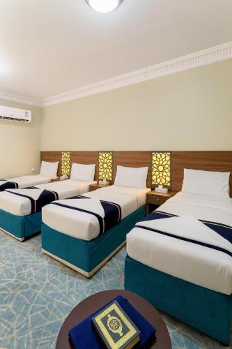 Katil atau katil-katil dalam bilik di Al Hashmeih Tower Hotel Makkah by Moro
