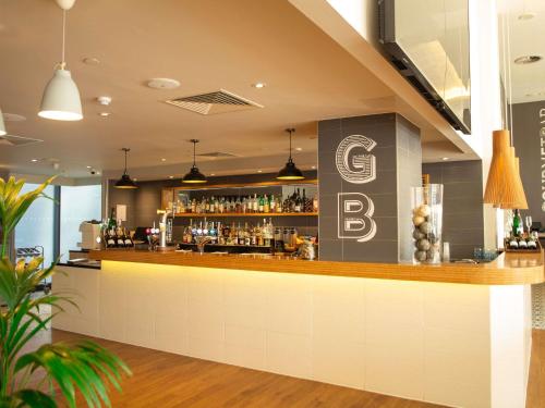 a bar with a sign that reads cb bar at Novotel London Wembley in London