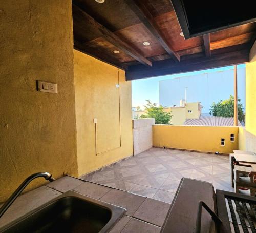 a kitchen with a sink and a large window at Private, centrally located, spacious and comfortable residence in Hermosillo