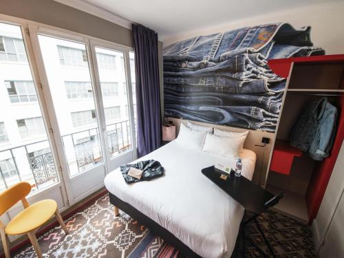 Un ou plusieurs lits dans un hébergement de l'établissement ibis Styles Lille Centre Grand Place