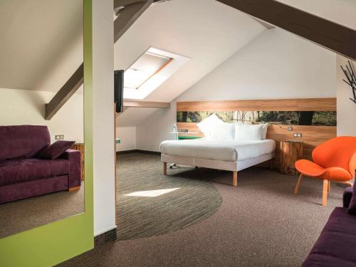 Ένα ή περισσότερα κρεβάτια σε δωμάτιο στο ibis Styles Sarrebourg