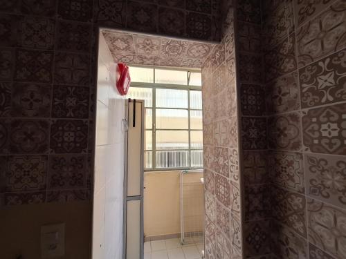 an open door to a room with a window at Loft in the Center of Serra Negra in Serra Negra