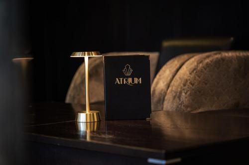 a lamp on a table next to a couch at President Hotel in London