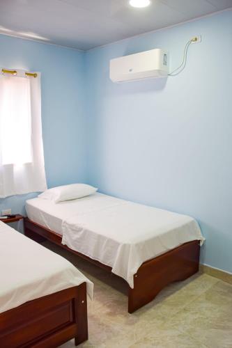 Letto o letti in una camera di Hotel CASA LENA