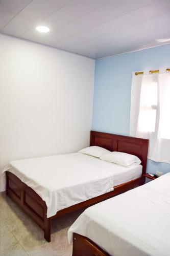 Letto o letti in una camera di Hotel CASA LENA