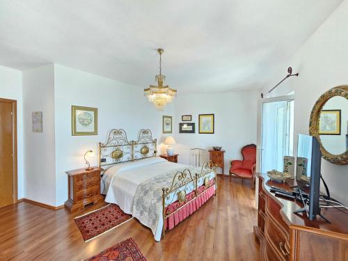 a bedroom with a bed and a television in it at MIMICA Double ROOM with private bathroom and terrace in Novi Vinodolski