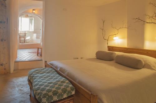Una cama o camas en una habitación de Alchimia Verde Herbaria