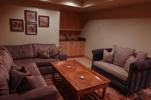 a living room with two couches and a coffee table at Luxury Home with Stunning 4 Peak Views in Tetonia