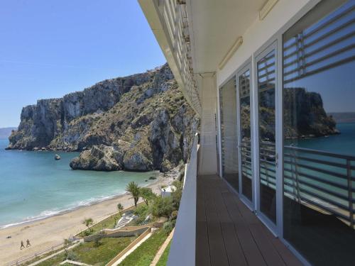a balcony of a house with a view of the beach at Mercure Quemado Al-Hoceima Resort in Al Hoceïma