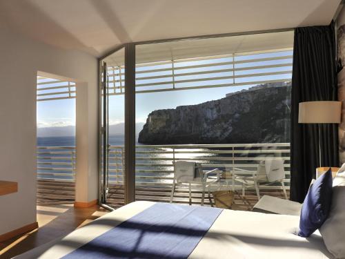 a bedroom with a view of the ocean at Mercure Quemado Al-Hoceima Resort in Al Hoceïma
