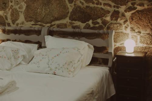 Ένα ή περισσότερα κρεβάτια σε δωμάτιο στο Quinta das Flores