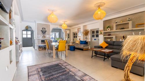 a living room with a couch and a table at Riad Ghazal in Essaouira