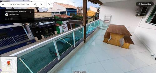 a view of a swimming pool in a building at Pousada Central de Arraial in Arraial do Cabo