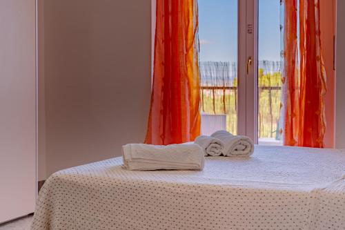 Ένα ή περισσότερα κρεβάτια σε δωμάτιο στο Guest House Monte Claro