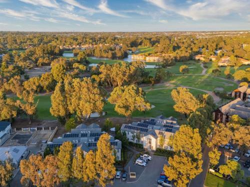an aerial view of a residential neighborhood with trees and houses at The Sebel Swan Valley the Vines in The Vines